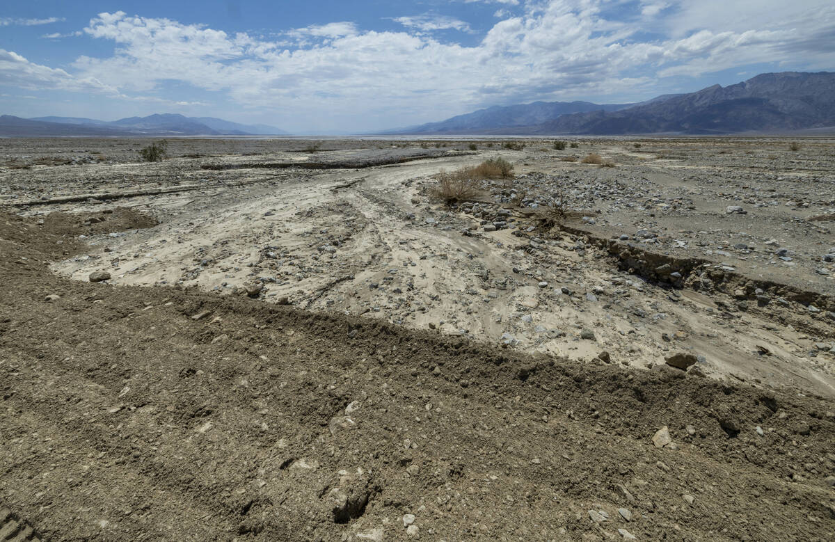 Dirt is piled high along State Road 190 near Beatty Road which is temporarily closed due to the ...