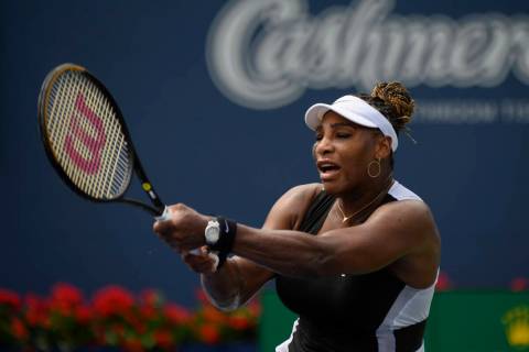 Serena Williams, of the United States, returns the ball during a match against Nuria Parrizas-D ...