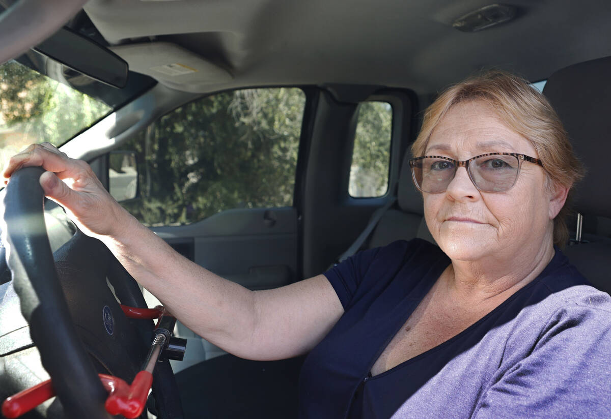 Leslie O’Brien sits in the driver’s seat of her truck parked at her house, Wednes ...