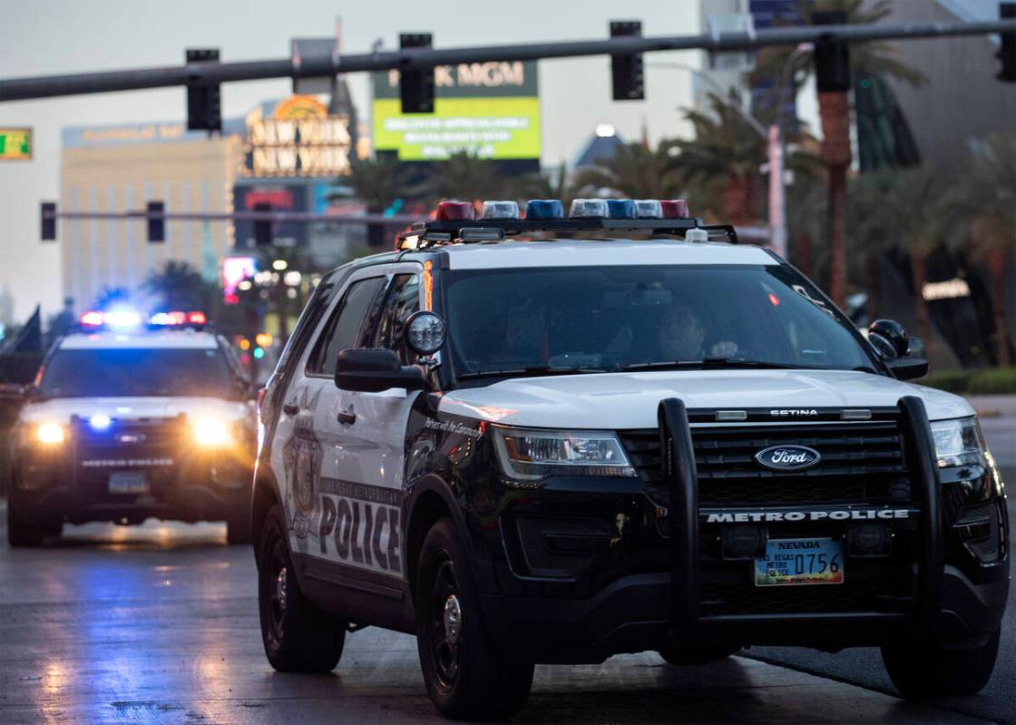 Metropolitan police patrol the Las Vegas Strip outside of Planet Hollywood on Tuesday, Aug. 2, ...