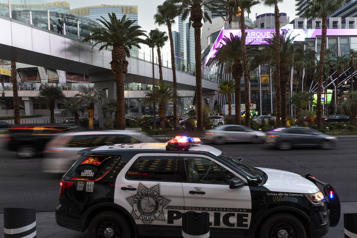 Metropolitan police patrol the Las Vegas Strip outside of Planet Hollywood on Tuesday, Aug. 2, ...