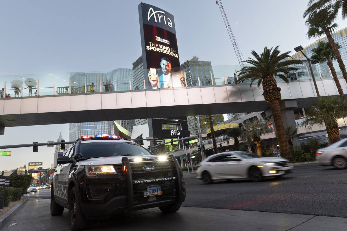 Metropolitan police patrol the Las Vegas Strip outside Planet Hollywood on Tuesday, Aug. 2, 202 ...