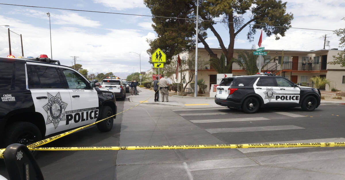 Las Vegas police investigate around the 4100 block of Pennwood Avenue, Tuesday, Aug. 9, 2022, i ...