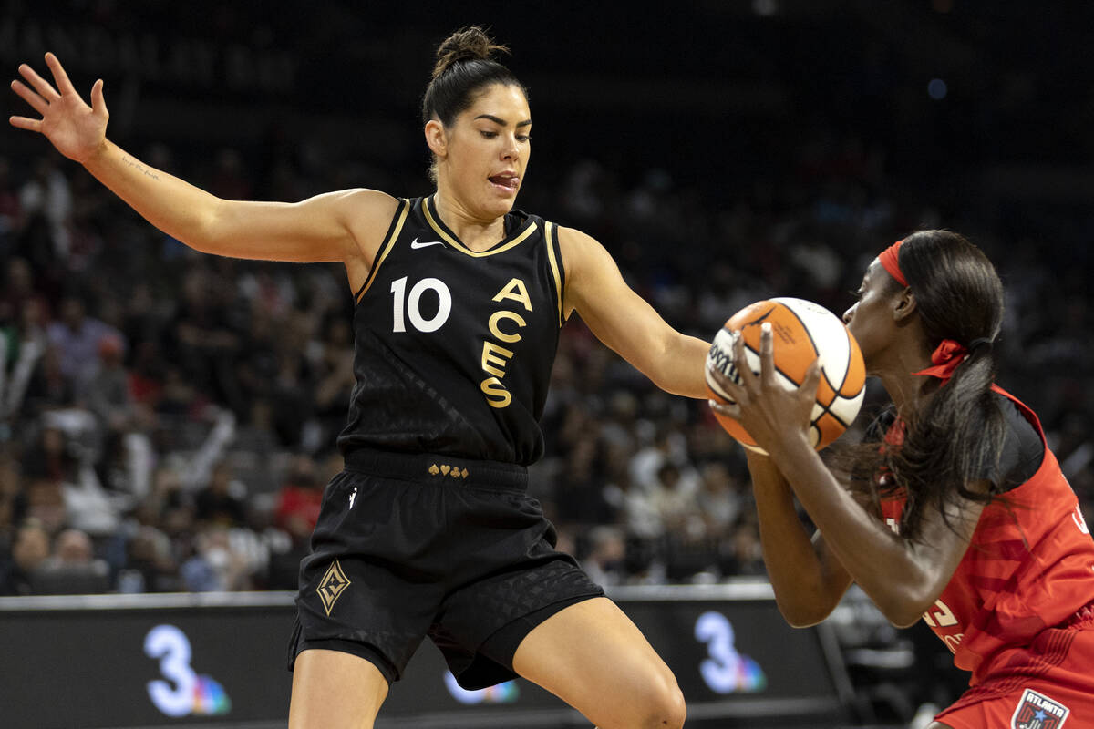 Las Vegas Aces guard Kelsey Plum (10) puts pressure on Atlanta Dream guard Maya Caldwell during ...
