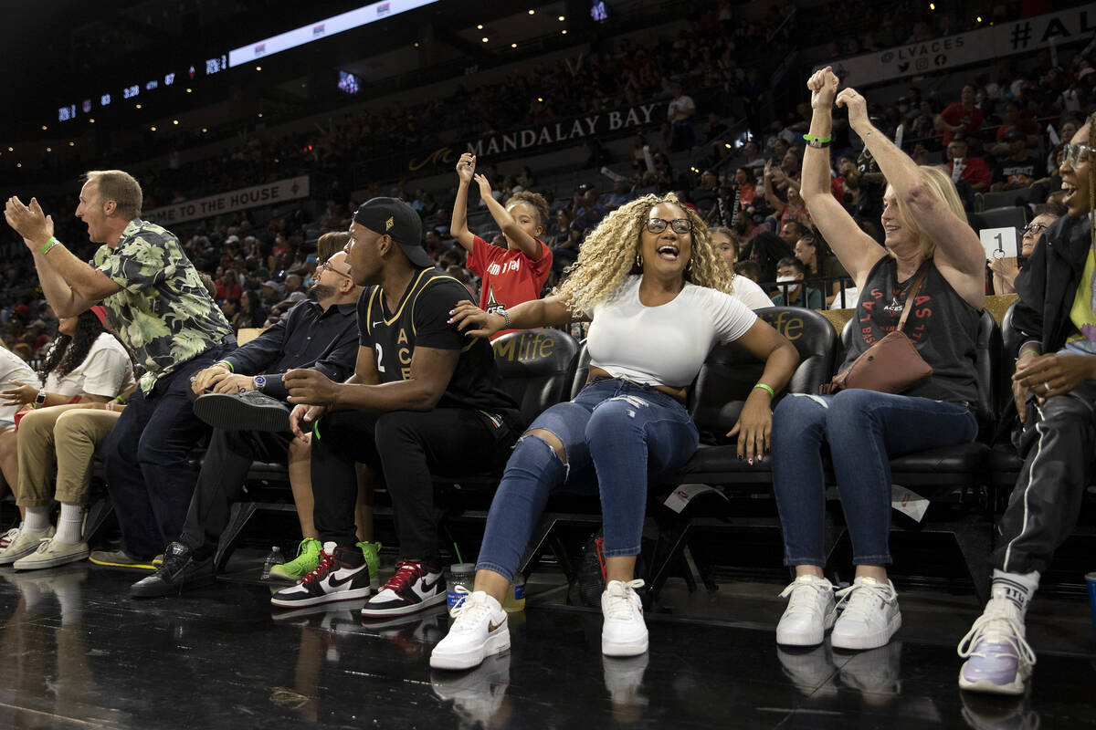 Las Vegas Aces fans cheer as their team takes the lead in the last few minute of the second hal ...