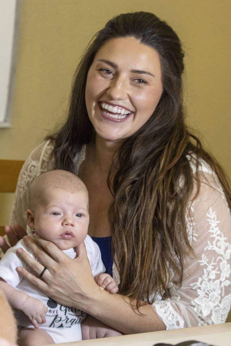 Carly Sieg, wife of Raiders long snapper Trent Sieg, not pictured, holds their three-month-old ...