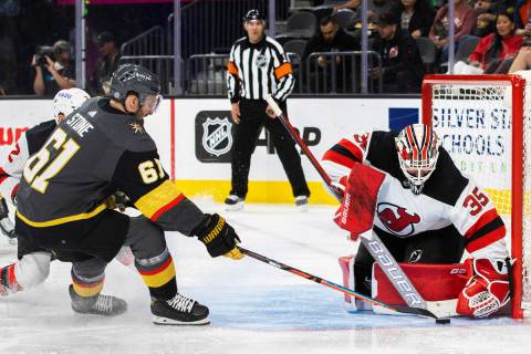 Golden Knights right wing Mark Stone (61) shoots on New Jersey Devils goaltender Andrew Hammond ...