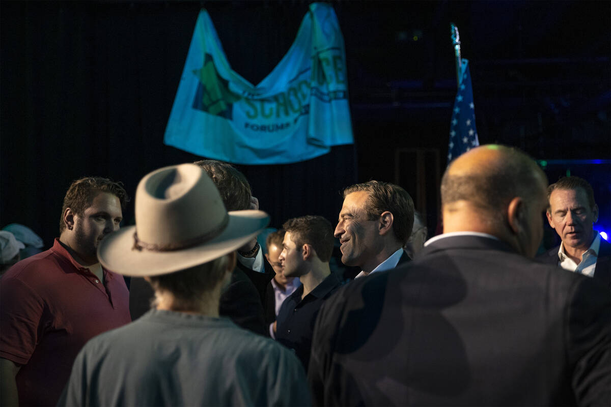 Republican Nevada Senate candidate Adam Laxalt, center right, chats with constituents after a f ...