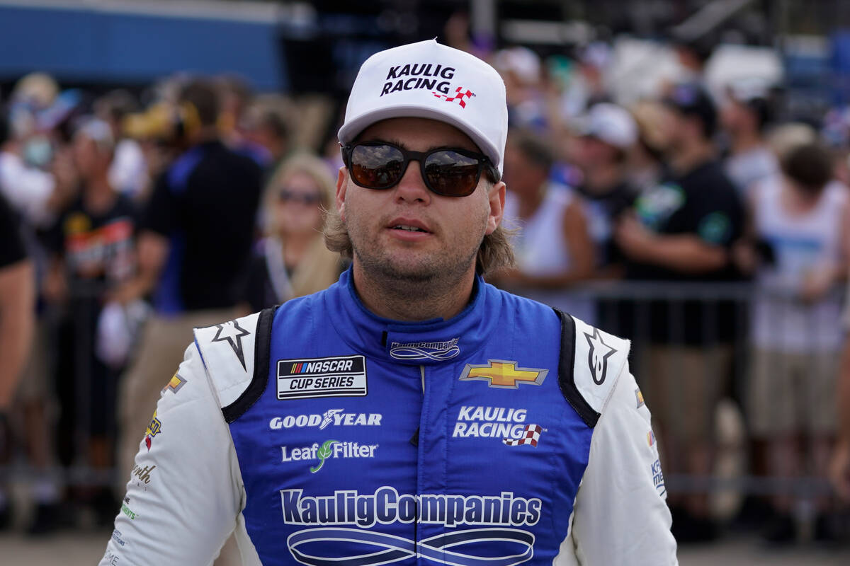 Noah Gragson walks to the track before a NASCAR Cup Series auto race at the Michigan Internatio ...