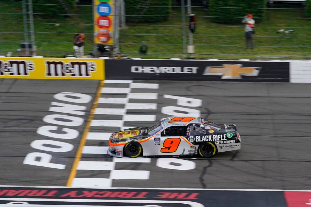 Noah Gragson (9) speeds to the finish line as he wins the NASCAR Xfinity Series auto race at Po ...