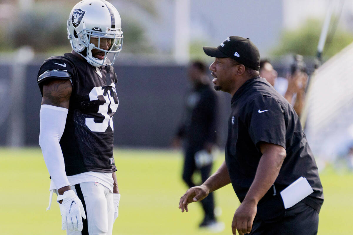 Raiders cornerback Nate Hobbs (39) works with defensive backs coach Jason Simmons during the te ...