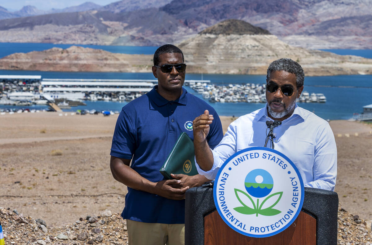 EPA Administrator Michael S. Regan, left, listen in as Congressman Steven Horsford speaks durin ...