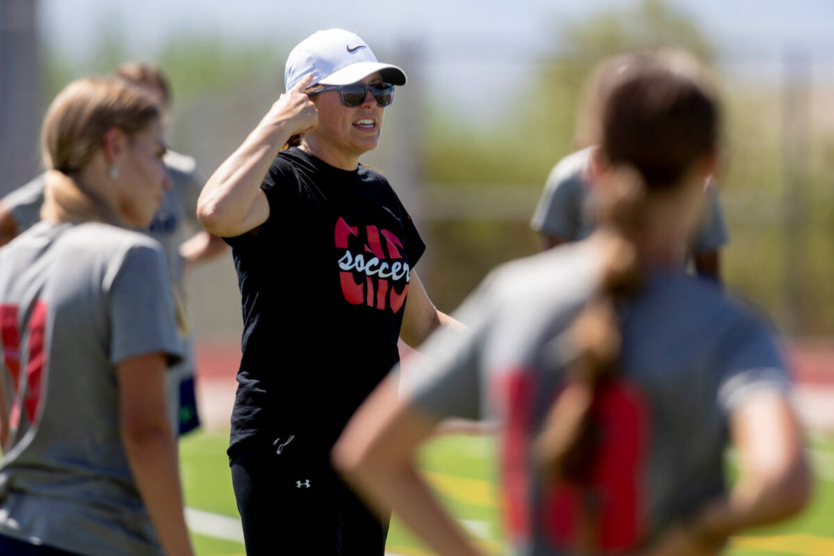 Coach Dana Neel gives directions to the Coronado High School girls soccer team during practice ...