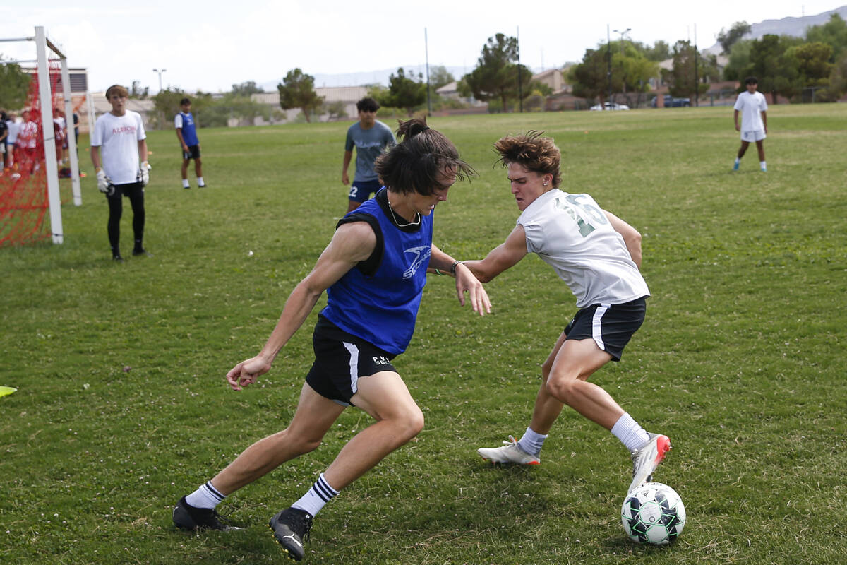 Palo Verde’s Quentin Gomez, battles for the ball against Matthew Vogel during soccer pra ...