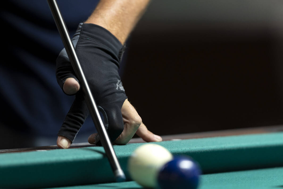 A competitor strikes the cue ball during the American Poolplayers Association World Pool Champi ...