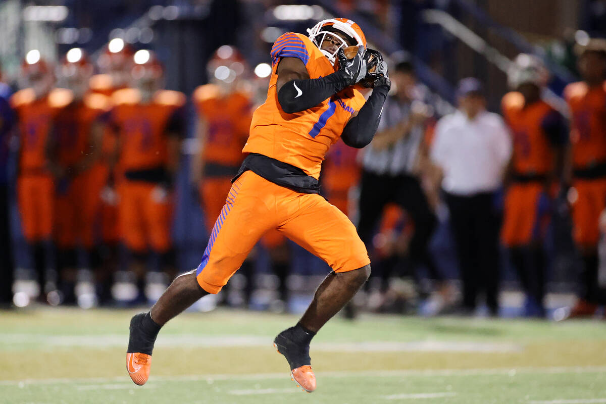 Bishop Gorman's Zachariah Branch (1) runs the ball for a touchdown after a catch in the fourth ...