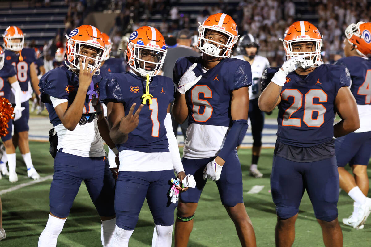 Bishop Gorman players pose following their win over Corner Canyon 42-7 during a football game a ...