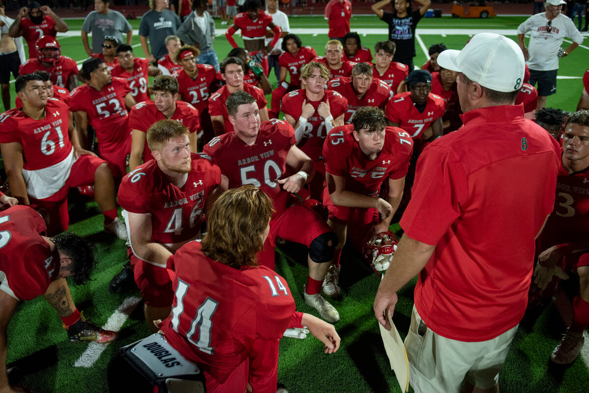 Arbor View High School huddles up after beating Snow Canyon 7-0 in the first game of the season ...