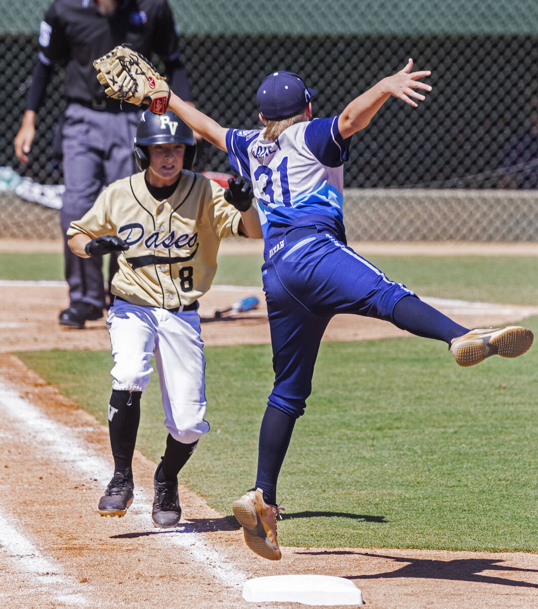 Paseo Verde's center fielder Dawson Schmitt (8) tagged out by Utah-Snow Canyon's first baseman ...