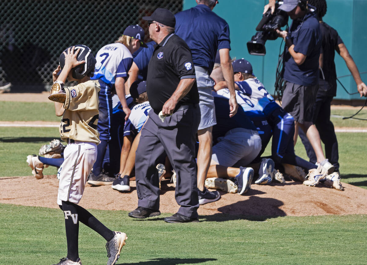 Paseo Verde's centerfielder Zach Pornoff (22) walks past Utah-Snow Canyon players as they celeb ...