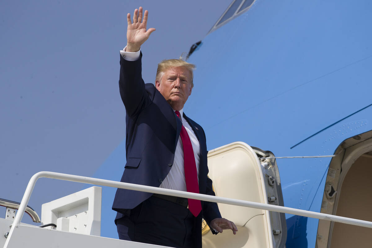 President Donald Trump waves as he walks to Air Force One as he departs Thursday, Aug. 1, 2019, ...