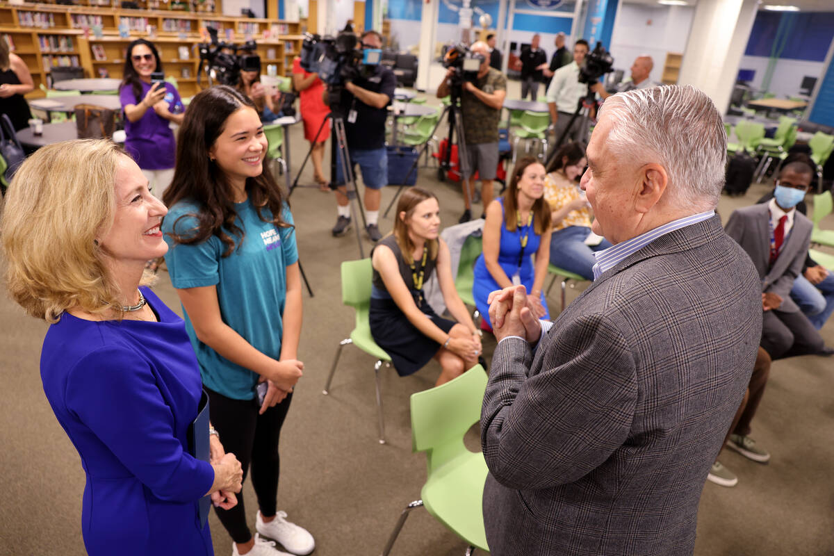 Nevada Gov. Steve Sisolak, right, visits with Julie Murray, co-founder of Hope Means Nevada, le ...