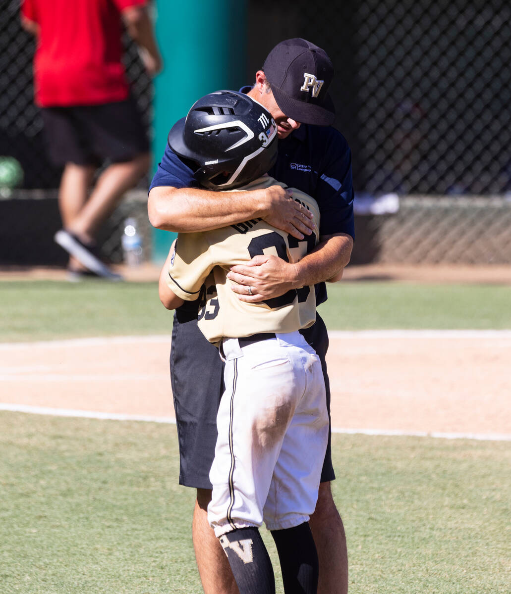 Paseo Verde's assistant coach Brian Gregorich console his son Ryland Gregorich (33) after losin ...