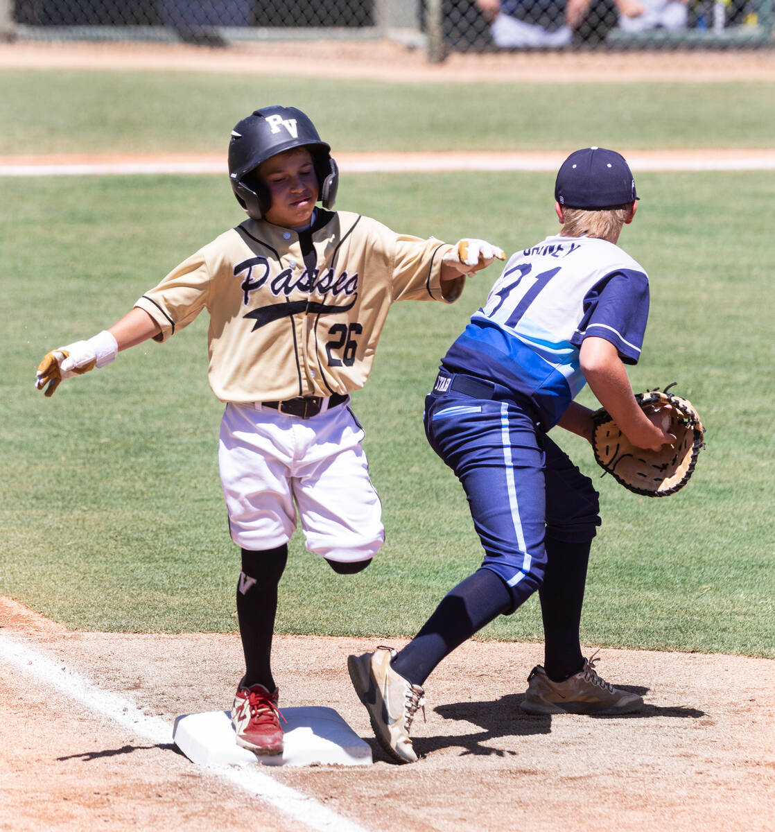 Paseo Verde's second baseman Caden Cadaver (26) is forced out by Utah-Snow Canyon's first base ...