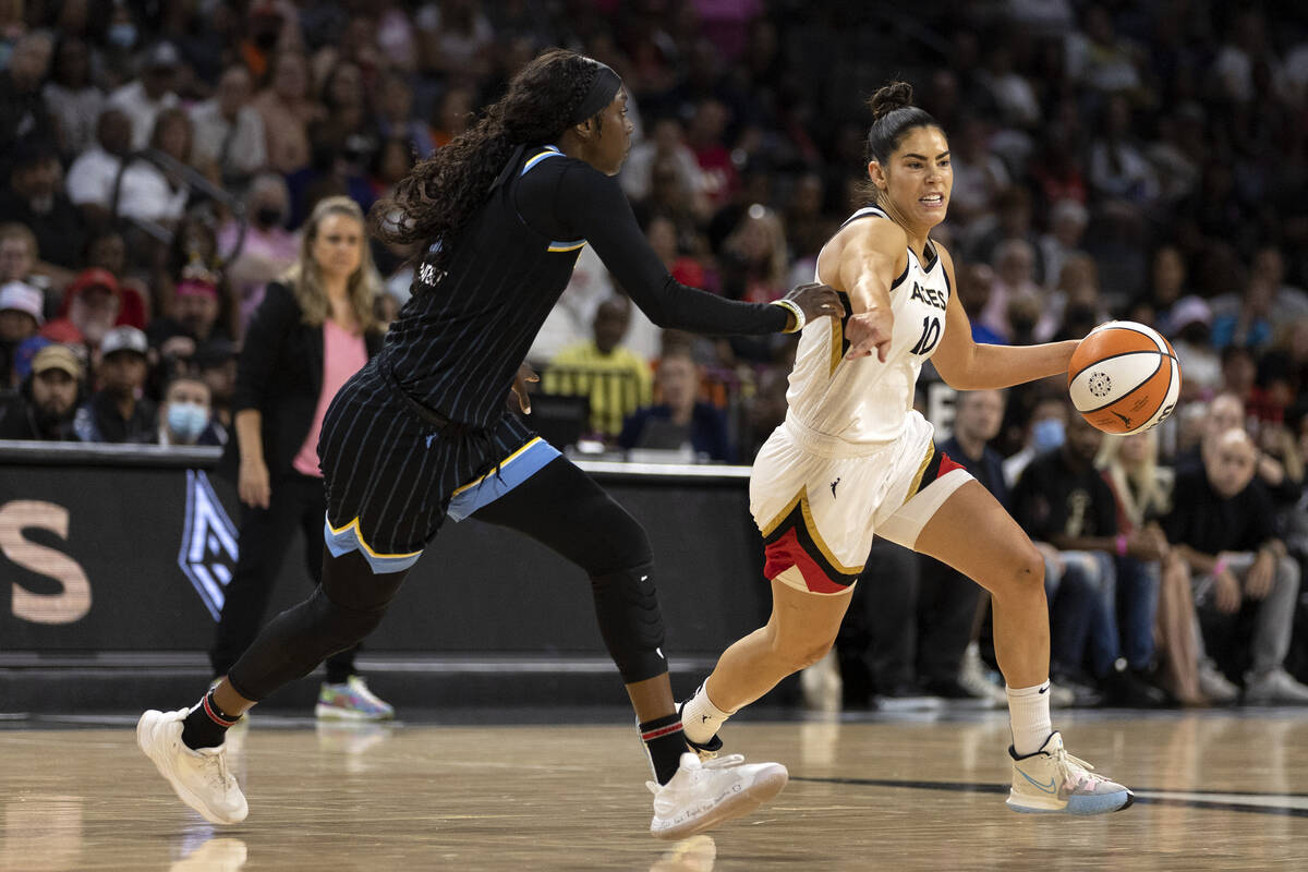 Las Vegas Aces guard Kelsey Plum (10) drives around Chicago Sky guard Kahleah Copper (2) during ...