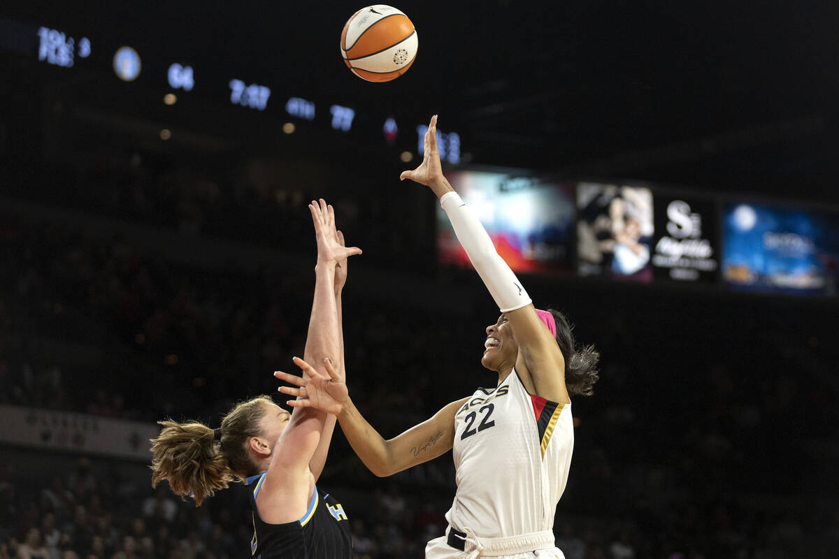 Las Vegas Aces forward A'ja Wilson (22) shoots against Chicago Sky forward Emma Meesseman (33) ...