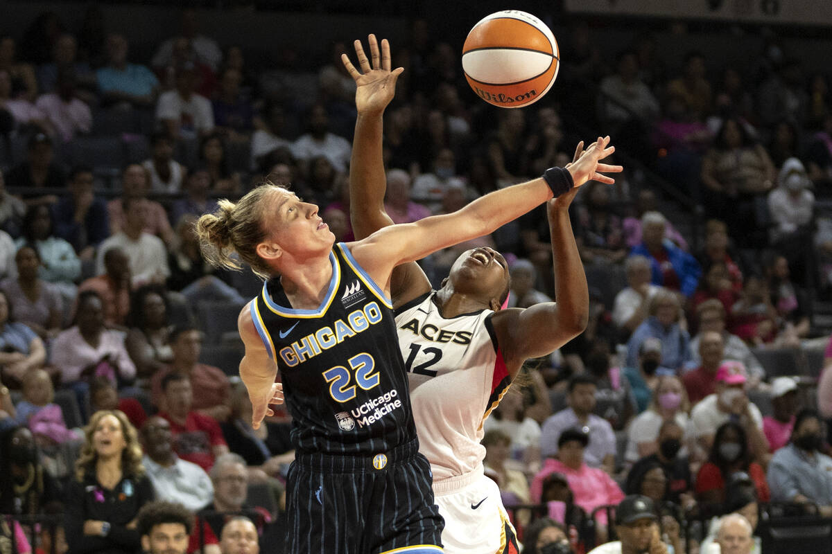 Chicago Sky guard Courtney Vandersloot (22) fouls Las Vegas Aces guard Chelsea Gray (12) during ...