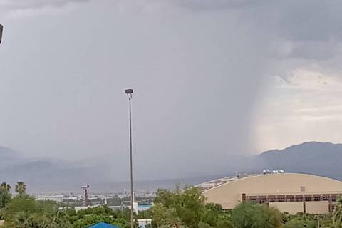 A storm cell drops rain on northeast Las Vegas about 2:45 p.m. Friday, Aug. 12, 2022. One gauge ...