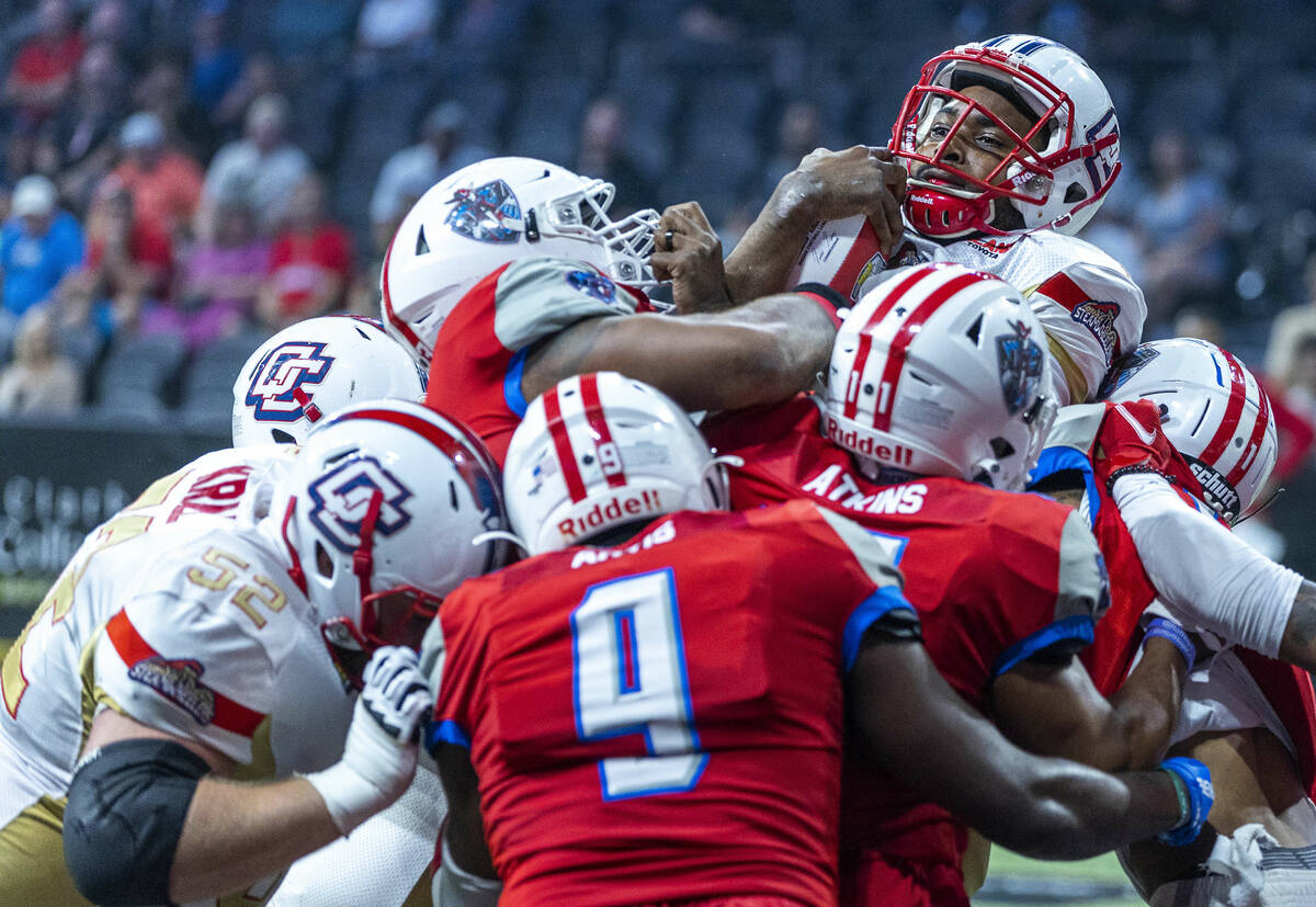 Quad City Steamwheelers quarterback E.J. Hilliard Jr. (12) goes over the top of the Northern Ar ...
