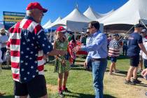 Republican Nevada Senate candidate Adam Laxalt, right, takes pictures with supporters at the se ...