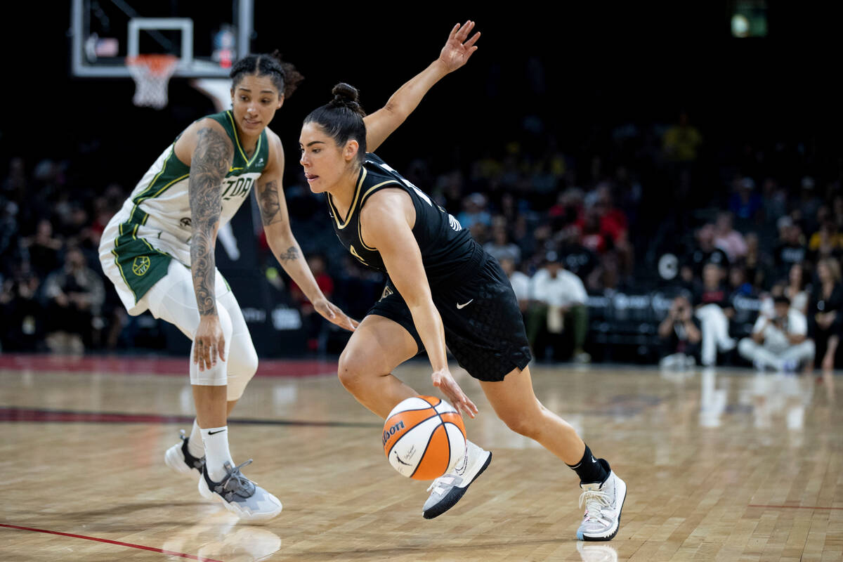 Aces guard Kelsey Plum (10) drives past Seattles's Gabby Williams (5) in the first half of the ...