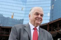 Gov. Steve Sisolak mingles with investor Joshua Saslove of Aspen, during a commencement ceremon ...