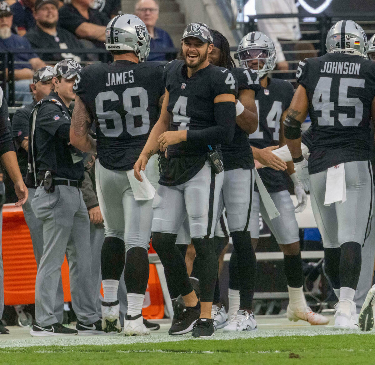 Raiders quarterback Derek Carr (4) smiles on the sideline during the first half of a preseason ...