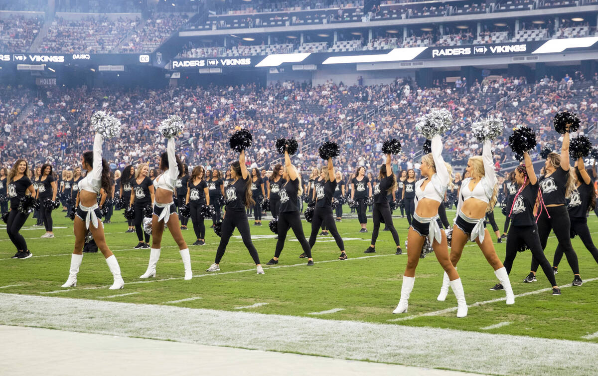 Raiderettes perform during halftime of a preseason NFL game to commemorate their 60-year annive ...