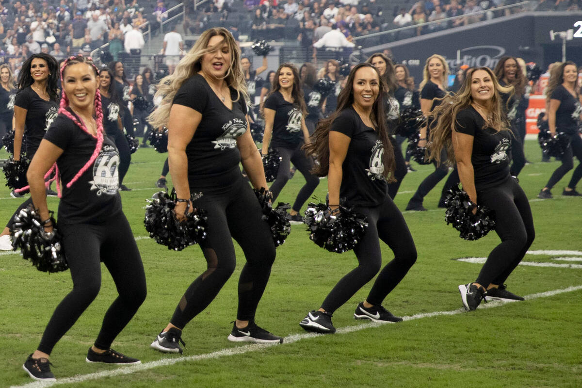 Raiderettes perform during halftime of a preseason NFL game to commemorate their 60-year annive ...