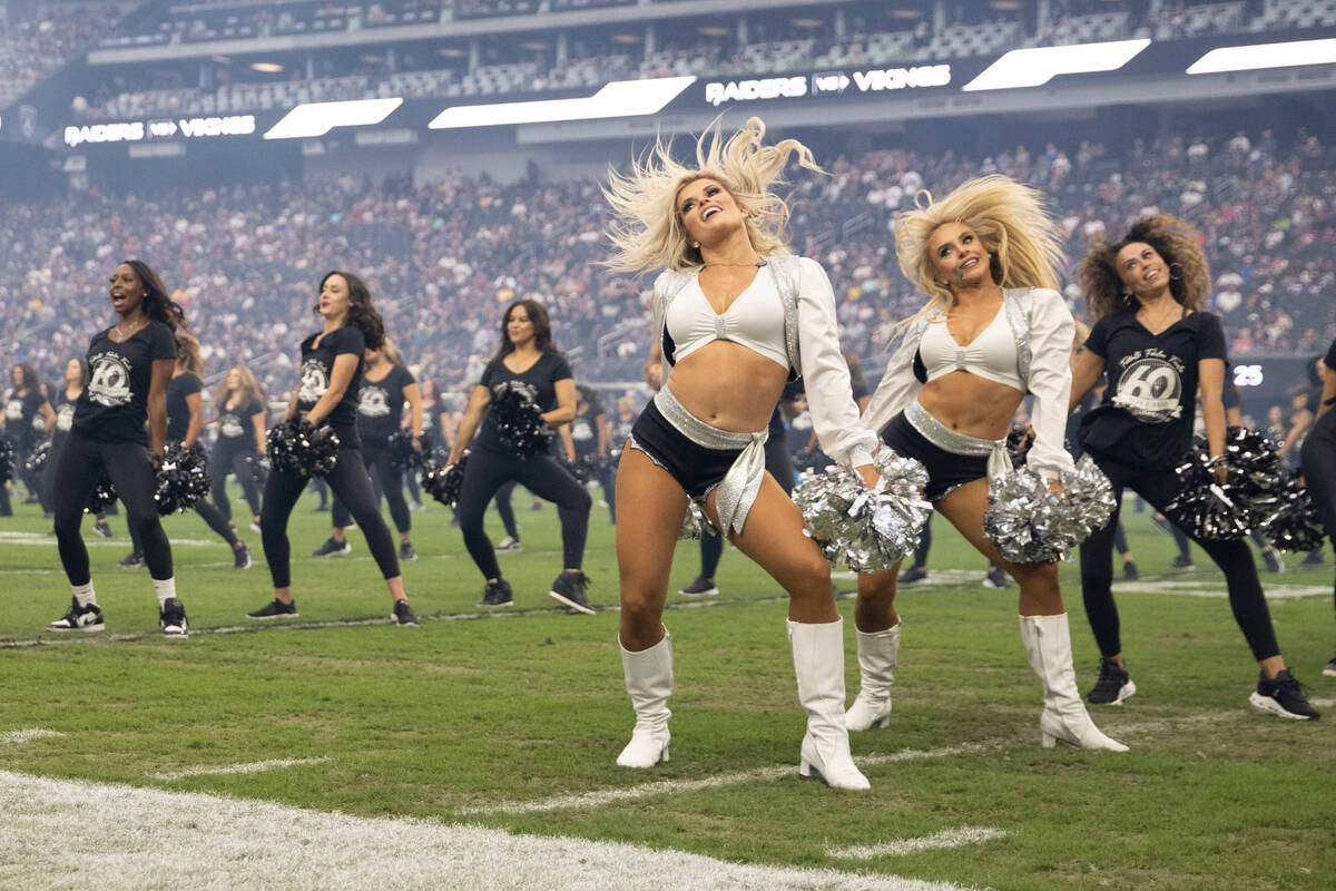 Raiderettes perform during halftime of a preseason NFL game to commemorate their 60-year annive ...