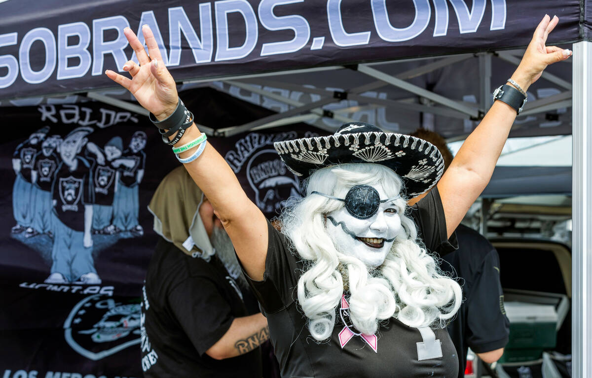 Raiders Rita gets pumped up with fans in the tailgating area before the Raiders versus Vikings ...