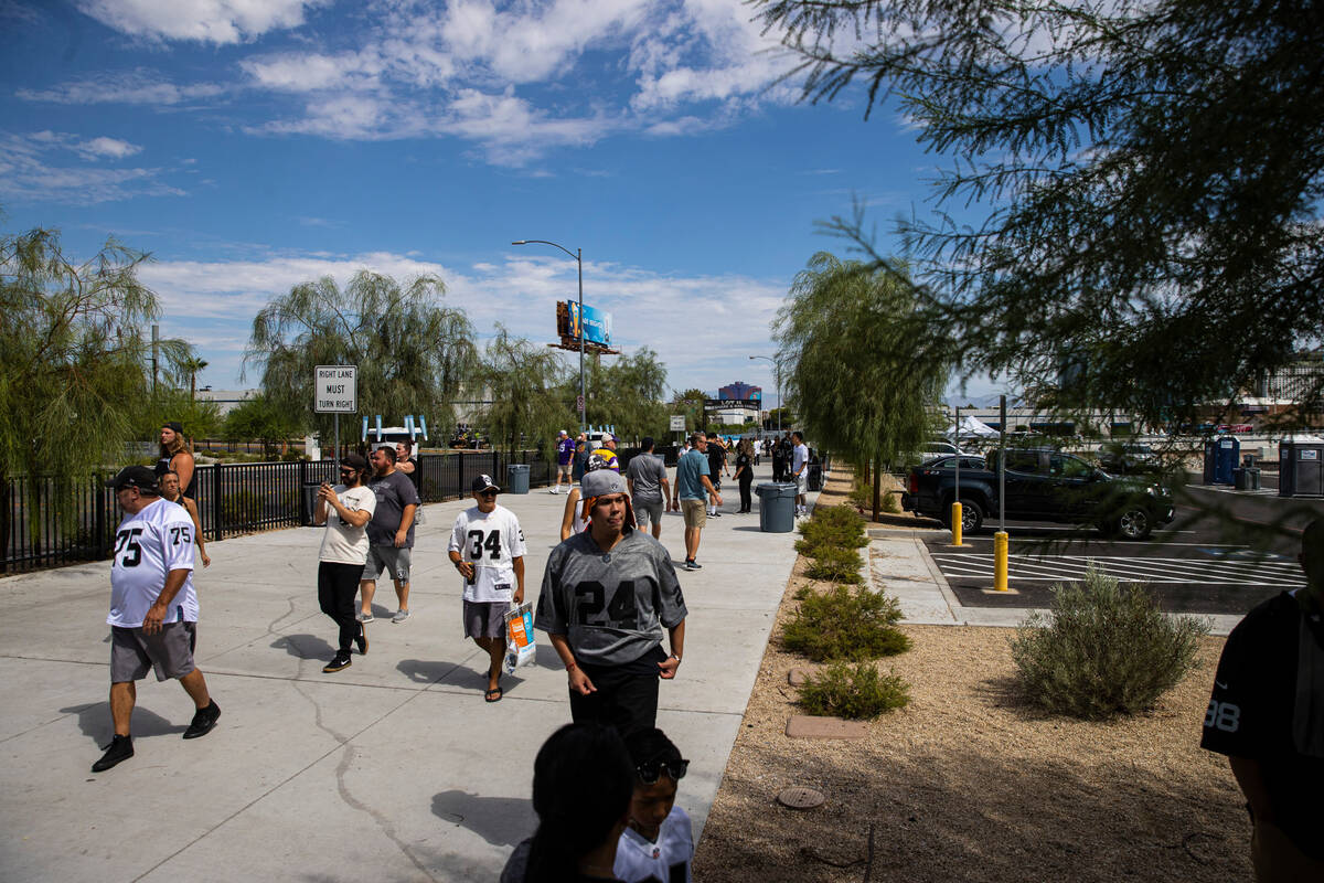 Raiders fans arrive before the start an NFL preseason football game against the Minnesota Vikin ...