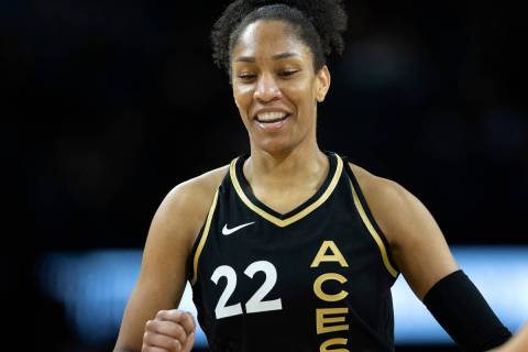 Las Vegas Aces forward A'ja Wilson (22) slaps hands with guard Kelsey Plum (10) during the firs ...