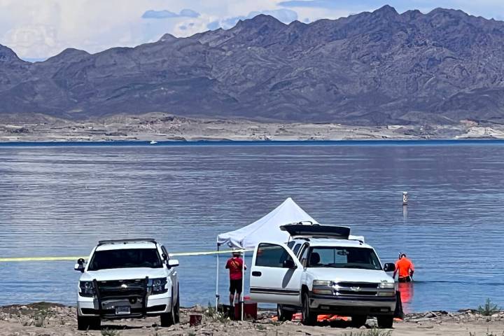 Divers are seen at Lake Mead National Recreation Area, Tuesday, Aug. 16, 2022, near Boulder Cit ...