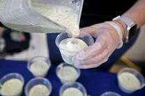 Melanie Thornton, a volunteer with the Dairy Council of Nevada, pours a smoothie for students a ...