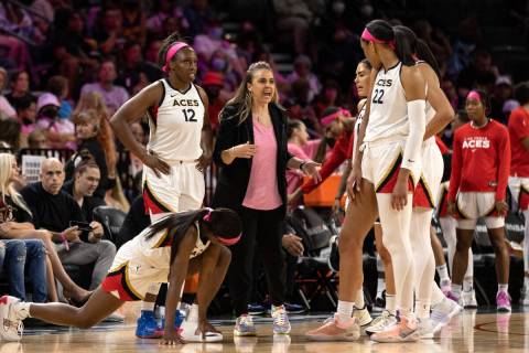 Las Vegas Aces head coach Becky Hammon speaks to her team in a timeout during the second half o ...