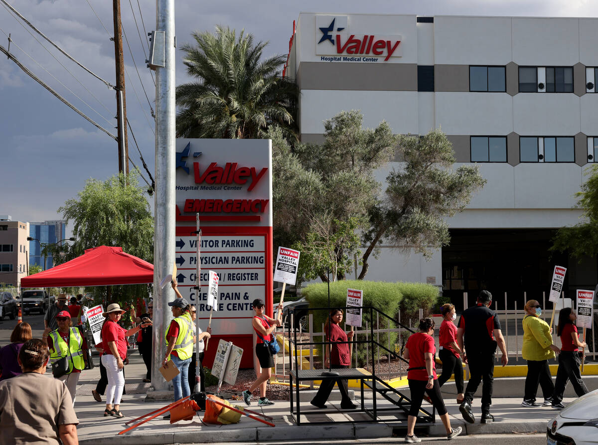 Members of the Culinary Union and supporters picket Valley Hospital Medical Center in Las Vegas ...