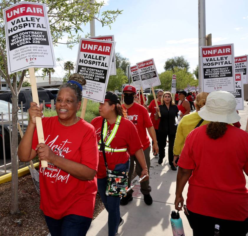 Members of the Culinary Union, including 40-year employee Betty Williams, left, and supporters ...
