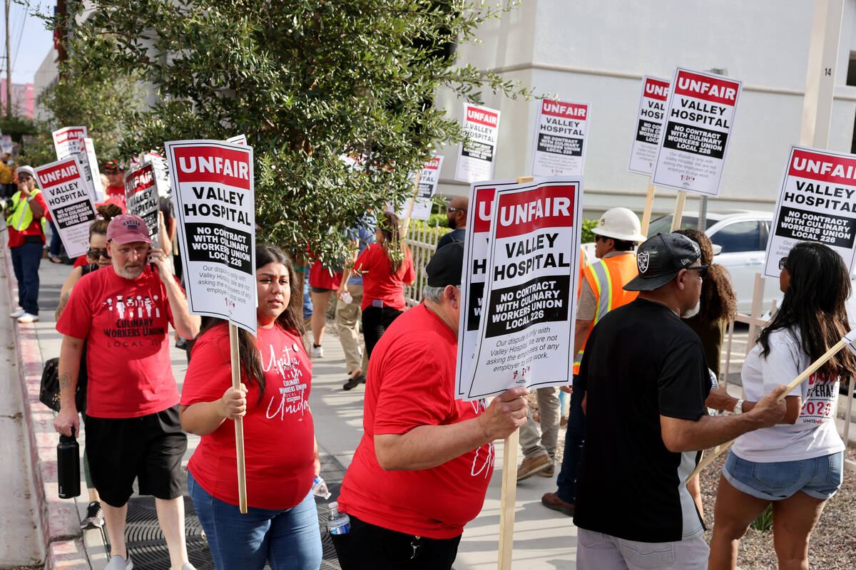 Members of the Culinary Union and supporters picket Valley Hospital Medical Center in Las Vegas ...