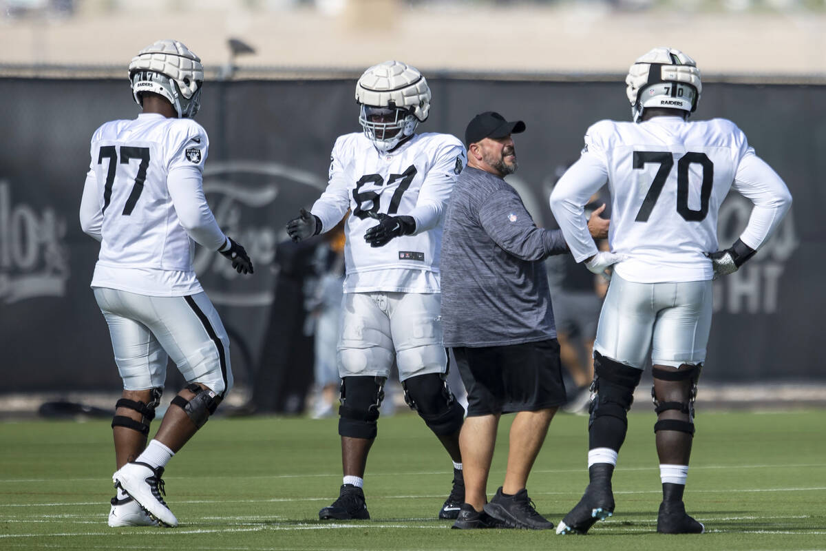 Raiders offensive linemen Thayer Munford (77), Lester Cotton, Sr. (67) and Alex Leatherwood (70 ...